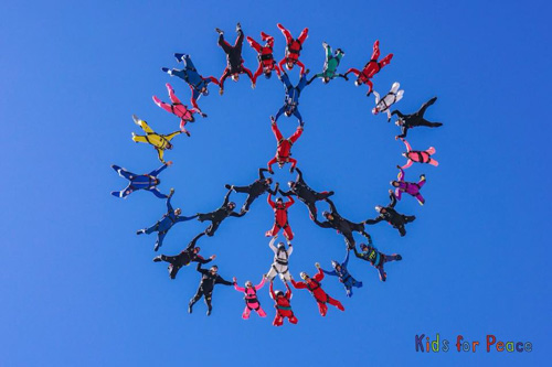 Skydiving in formation of peace sign