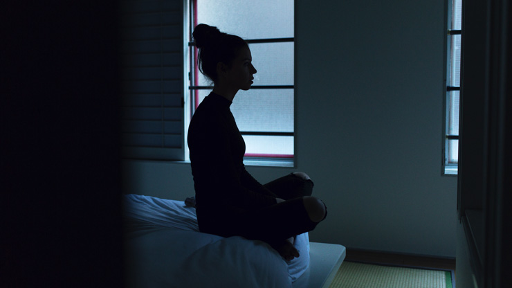 Sleep, girl meditating on bed, by Sarah Cummings, photograph by Ben Blennerhassett