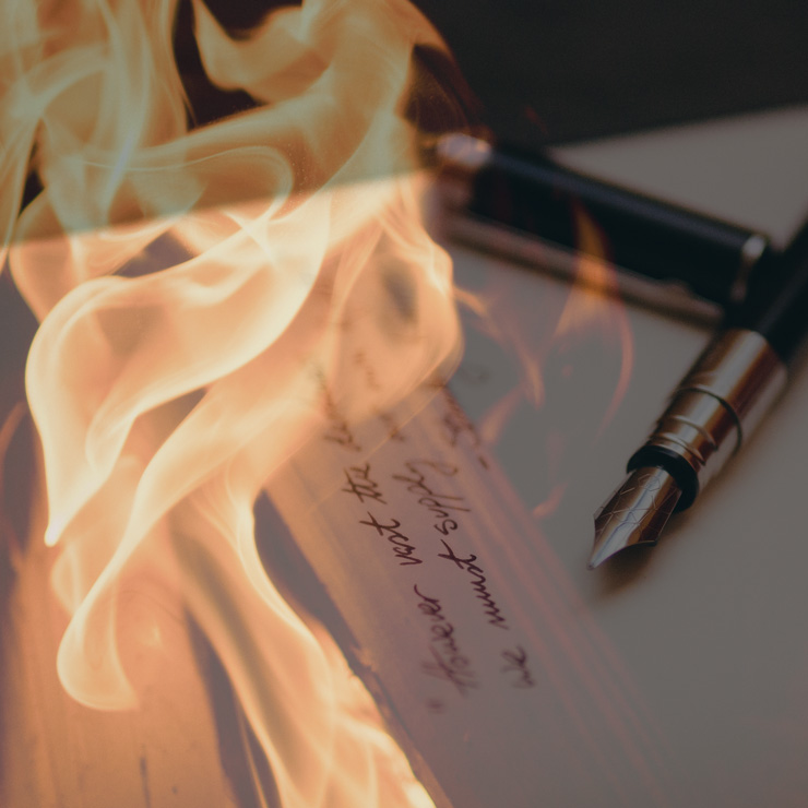 Light and Shadows on a Person Burning Letters into Wood Stock Photo