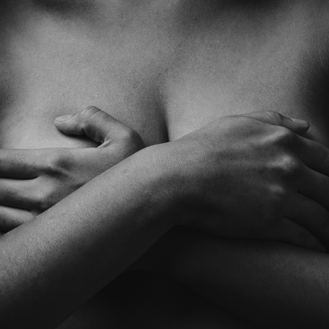 Mastectomy & Self Love, by Sarah Davis. Photograph of woman holding her breasts by Ivan Stern