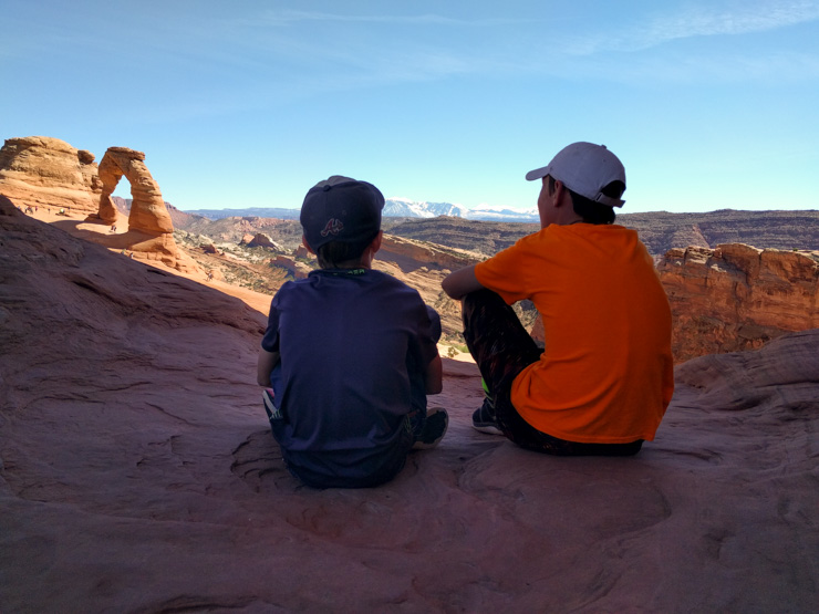 Two boys looking at landscape in Utah