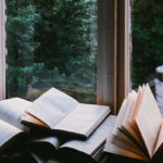 Photograph of books in window by John Mark Smith