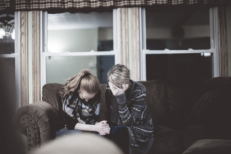 Understanding Codependency and Breaking the Cycle of Self Betrayal, by Laura Bishop. Photograph of two people on couch by Ben White