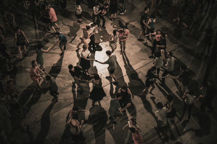 Dancing Alone: A Social Experiment in Courage, by Jeanie Tillman. Photograph of group dancing by Ardian Lumi