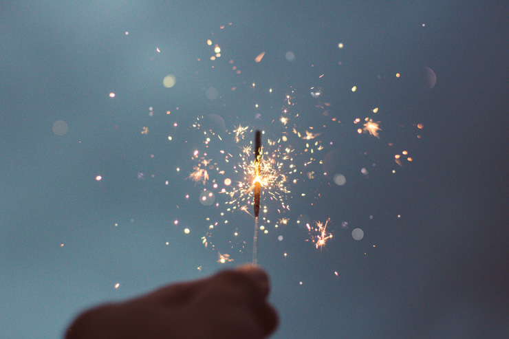 Two Powerful Questions to Ask Before Stepping Into a New Year, by Sara Fabian. Photograph of a sparkler by Christian Escobar.