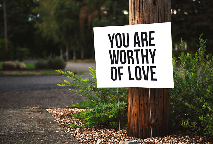 Why You Should Cultivate and Practice Self-Compassion by Barbara Larrivee. Photograph of a sign that says 'You are worthy of love' by Tim Mossholder