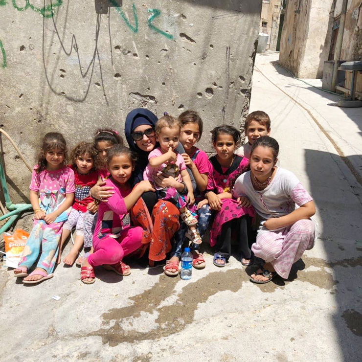 Photograph of Noor with children in Mosul