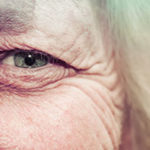 3 Reasons Why Women Over 50 Should Consume Probiotics by Lorna Frances. Up close photograph of an older woman's eye by Alipay Tonga