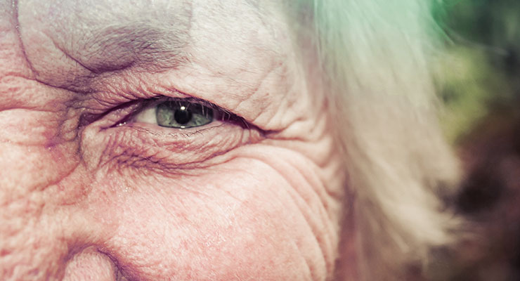 3 Reasons Why Women Over 50 Should Consume Probiotics by Lorna Frances. Up close photograph of an older woman's eye by Alipay Tonga