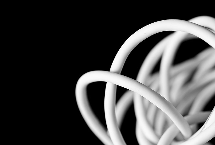 Digital Minimalism: How to Manage Technology to Reclaim Your Life by Vinayak Garg. Photograph of coiled up power chord by Dennis Brekke.