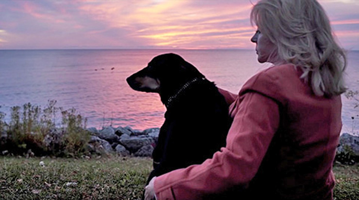 Saving Sadie: Loving A Dog With Special Needs… and Paying It Forward by Joel Derse. Photograph of Sadie and Joal at sunset