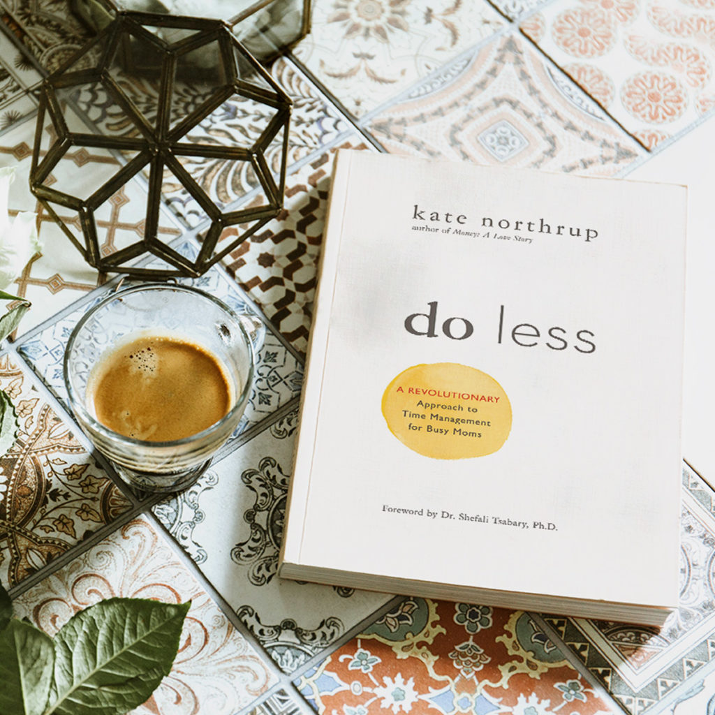 Photograph of Kate Northrup's book "do less" on top of a coffee table
