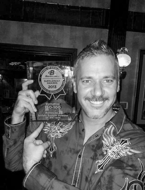 Photograph of Shawn with a Body Building Supplements award