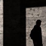 Against All Odds: A Story of Triumph, Perseverance, Healing and Service by Shawn Wells. Photograph of a man with a shadow by Rene Bohmer