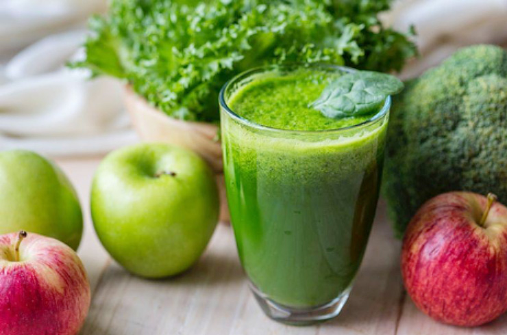 Blender Tips: Getting the Most from Your Smoothies by Conner Flynn. Photograph of a green smoothie with apples and kale