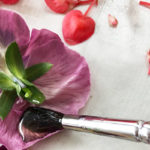 FLOWER POWER: The Edible Art of Candied Flowers by Chef Christine Moss. Photograph of flower petals being painted with simple syrup, courtesy of Chef Christine Moss