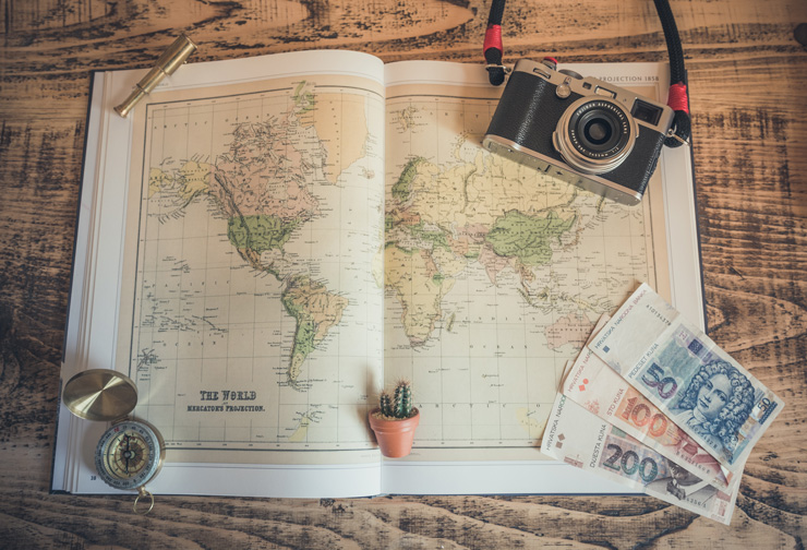 Explore More: Tips To Travel Abroad On A Budget, by Paisley Hansen. Photograph of world map by Chris Lawton