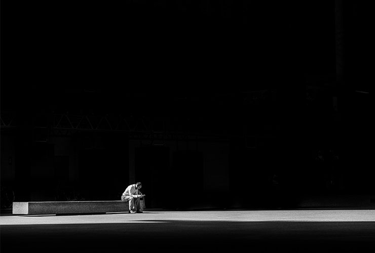 What’s Your Truth? Tools for Discerning What’s Right for You. High Contrast photograph of a man sitting on a bench reading, by Matthew Henry