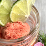 Recipe: Watermelon, Coconut & Lime Granita by Chef Christine Moss. Photograph of a mason jar with watermelon, coconut & lime Granita.