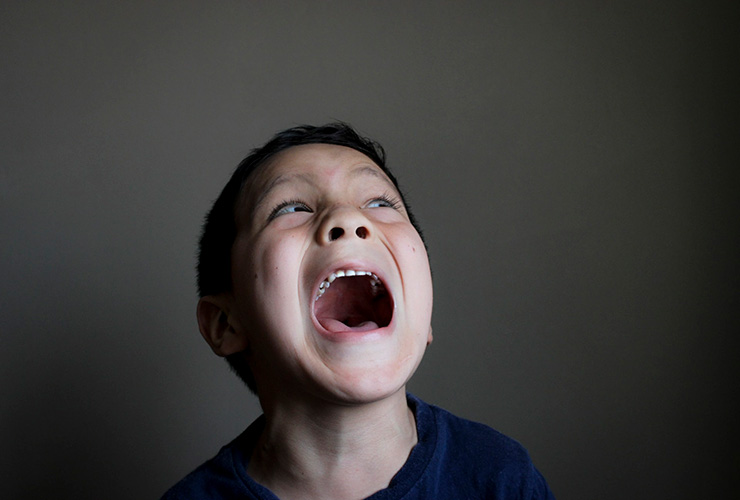 Understanding Your Child’s Temper Tantrums — and How to Deal with Them by Juan Koss. Photograph of a child screaming by Luz Fuertes
