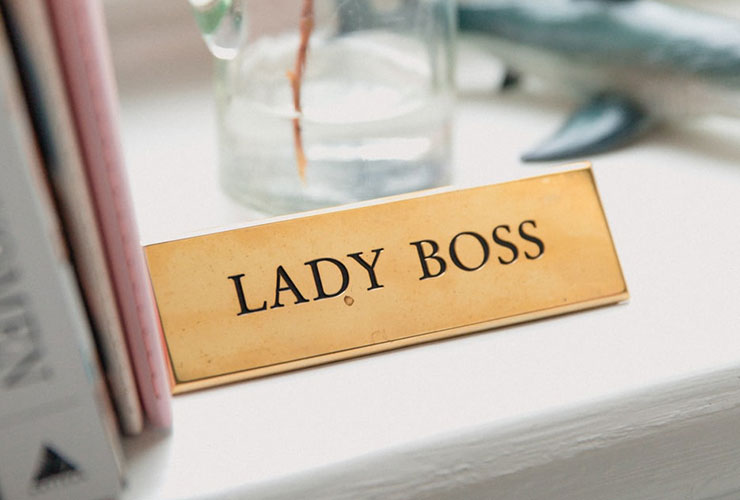 Overcoming the Challenges of Being a Successful Mother and Businesswoman by Marja Zapusek. Photograph of a metal sign that reads "Lady Boss" by Marten Bjork.