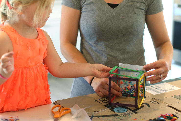 Creating Crafty Fun: DIY Projects to Do with Your Kids by Allen Michael. Photograph of a mom and daughter creating a craft out of popsicle sticks