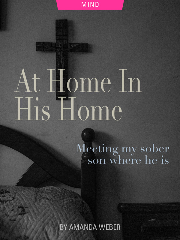 At Home In His Home: Meeting My Sober Son Where He Is, by Amanda Weber. Photograph of cross over bed by Sergio Rodriquez Portugues Del Olmo