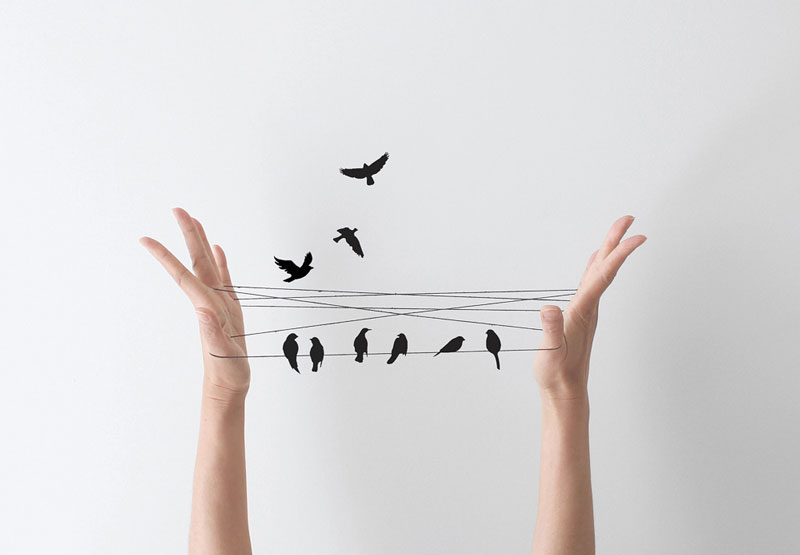 BECOMING: Beyond Achieving, Acquiring, Doing…Who Are You Becoming? By Kristen Noel. Photograph of hands holding string with mock birds by Peechaya Buroughs