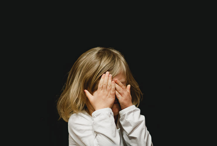 Don't Tell Me You're Sorry: A Call for More Honest Communication by Judy Marano. Photograph of a child covered her face with her hands by Caleb Woods