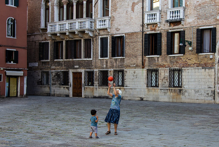 Life Beyond 100: What Can You Do To Increase Your Longevity? by Reizel Sales. Photograph of an older woman playing ball with a young child by Clement Falize