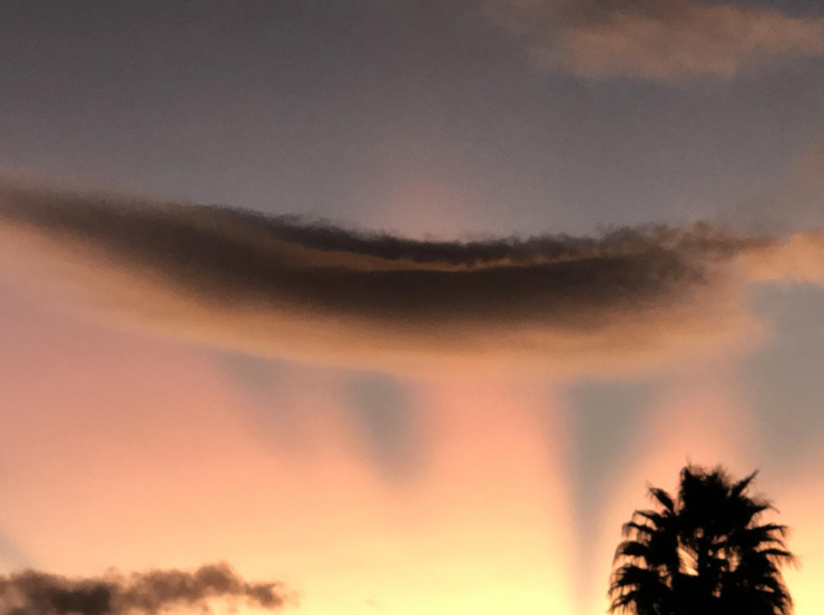 Photograph of a cloud in the sky at sunset in Hawai'i