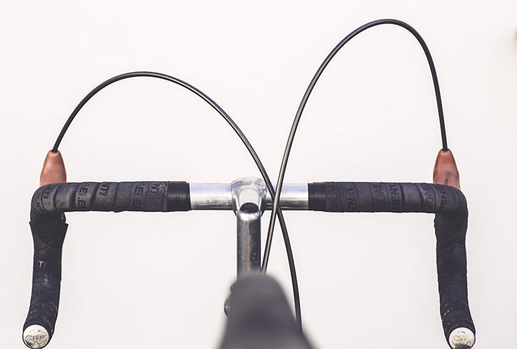 Cycling for Life: Q&A with Cancer Survivor and Charitable Activist Blake Bohlig by Bill Miles. Photograph of a bicycle handlebars by Markus Spiske