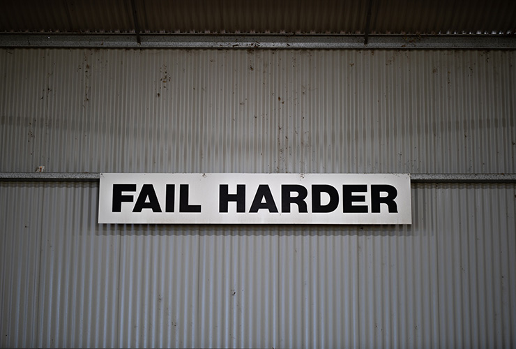 Shifting the Mindset of Failure Can Set Yourself Up to Succeed by Monica Levi. Photograph of a sign that says 'Fail Harder' by Julian Dutton