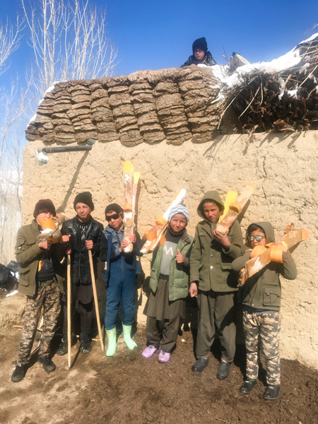 Photograph of children with homemade skis in Afghanistan
