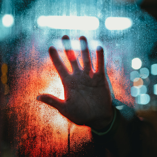 The Virus of Fear: How to Cope with Fear in Times of Uncertainty, by Sara Fabian. Photograph of hand against window by Josh Hild