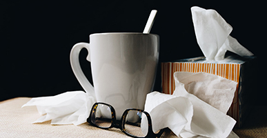 The Mental and Emotional Causes of COVID-19 by Maureen Minnehan-Jones. Photograph a box of tissues and a cup of tissue by Kelly Sikkema.