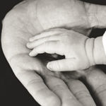 The Complex Rules for Raising Adult Children: From Protector to Guide by Judy Marano. Photograph of a parent holding a child's hand by Liane Metzler