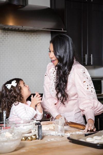 Vani Hari and daughter baking in kitchen. Photograph by Susan Stripling