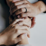 What Not to Say to Someone Living with Chronic Illness by Sweta Vikram. Photograph of two people holding hands by Priscilla Du Perez