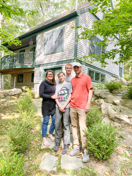 Celeste Orr with her family in front of their new home; photograph c/o Celeste Orr
