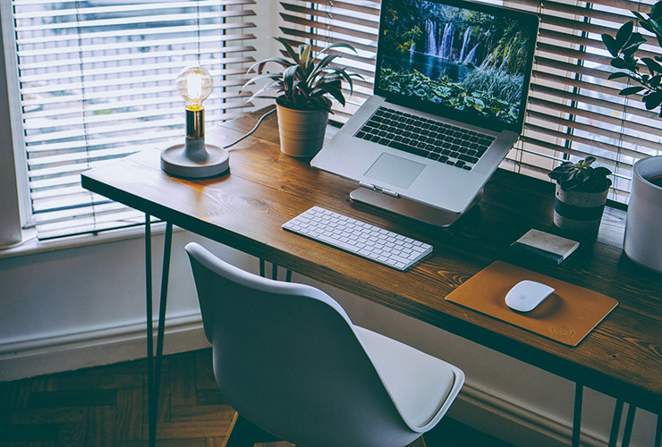 5 Tips for Creating a Home Office that Won’t Wreck Your Body by Dr. Shira Weiner. Photograph of a neat home office set up by Nathan Riley