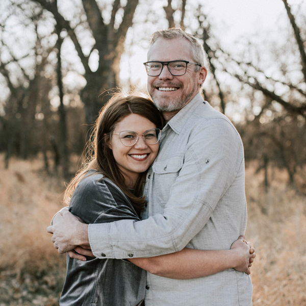 Finding My Voice: The Unexpected Silver Lining in a Traumatic Life Chapter, by Molly Weisgram. Photograph of Molly Weisgram and husband, outside.