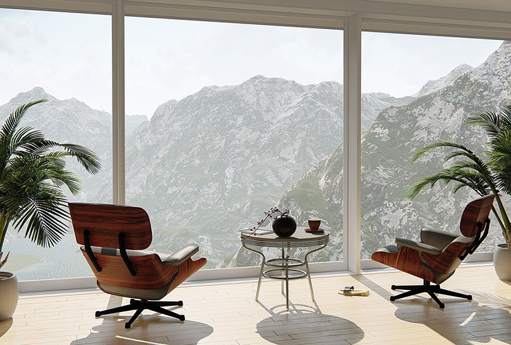 4 Tips for Designing a Positive and Calming Home by Laura May. Photograph of two chairs by a window, overlooking a mountain by Arek Socha.