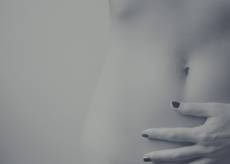 Your Gut-Brain Connection Might Explain your Anxiety… and Much More, by Sweta Vikram. Photograph of a woman with her hand on her belly by Ava Sol