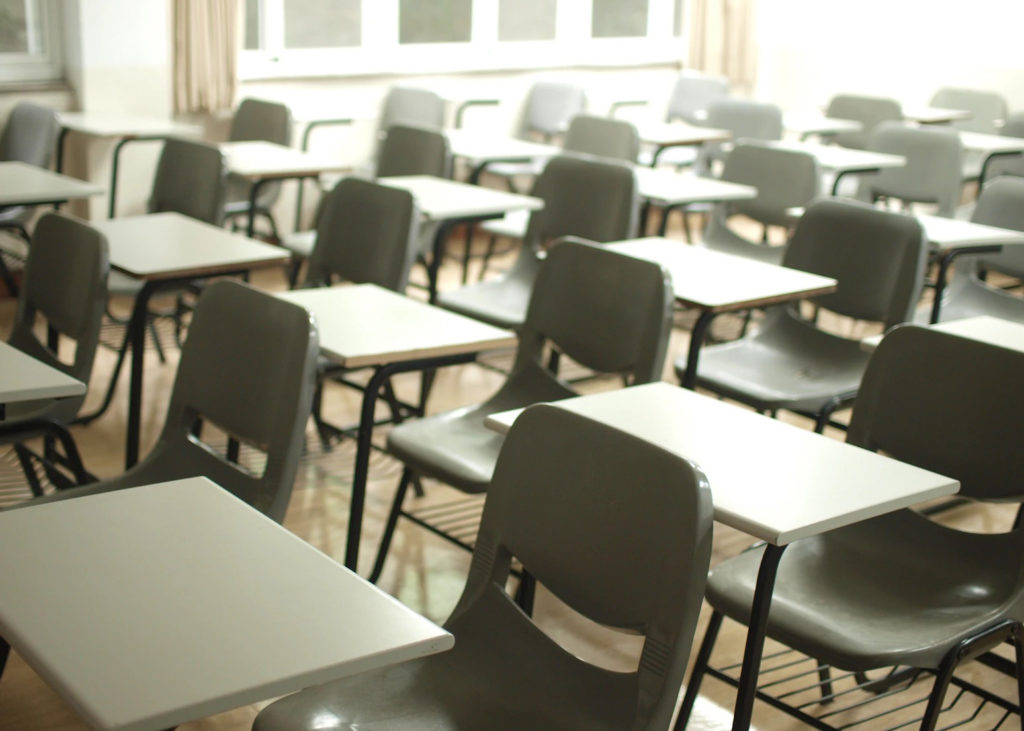 School Challenges: 6 Ways to Keep Your Kids Motivated and Engaged by Christina Pankiv. Photograph of an empty school classroom by MChe Lee