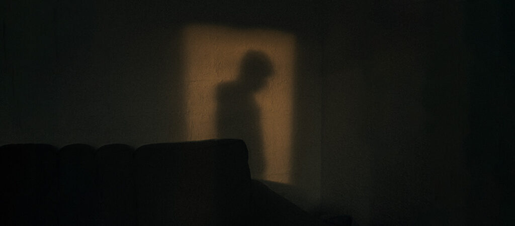 Success & Unworthiness: A Lifelong Struggle with Low Self-Confidence, by Edward Green. Photograph of man in dark silhouette by Majestic Lucas