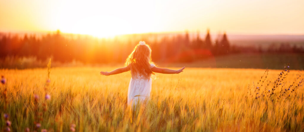 Healing and the Inner Child: A Best Self Q&A, by Christina Prokos. Photograph of young girl running through a field by Pliona