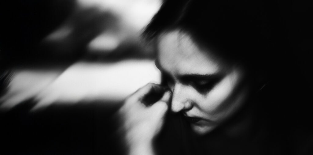 Woman shrouded in darkness, striving for forgiveness
