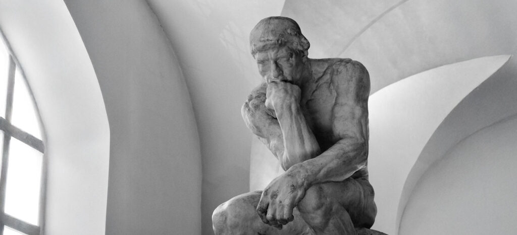 Statue of The Thinker, pondering the idea of who controls your mind?